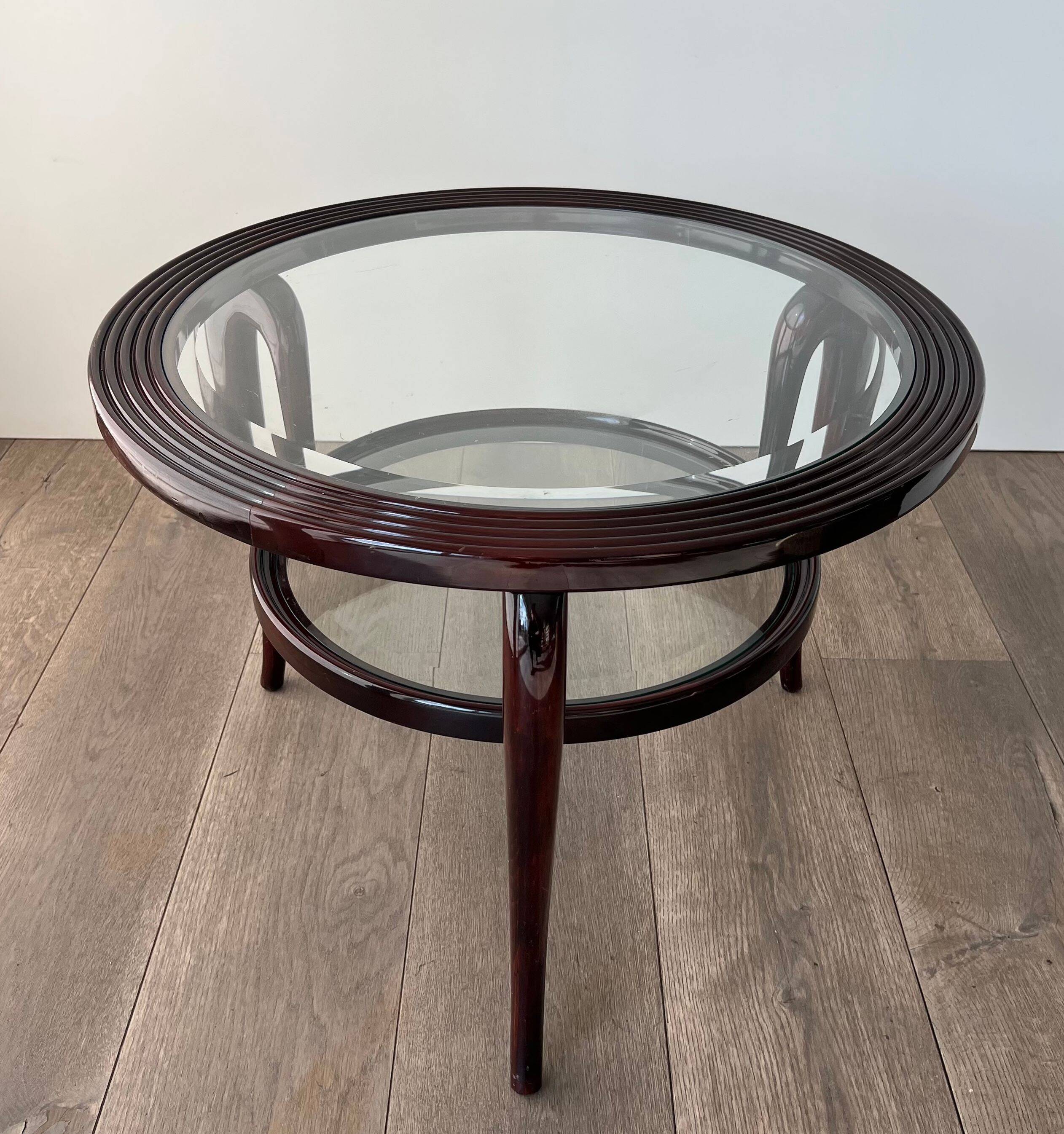 Round mid-century coffee table in walnut with a double top by Paolo Buffa.