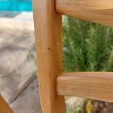 3 Scandinavian-style chairs, light wood and black faux leather