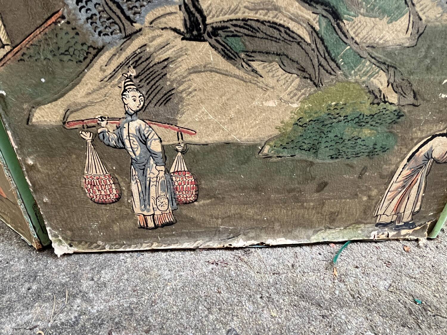 Wooden screen in Asian style, covered with Chinese wallpaper.