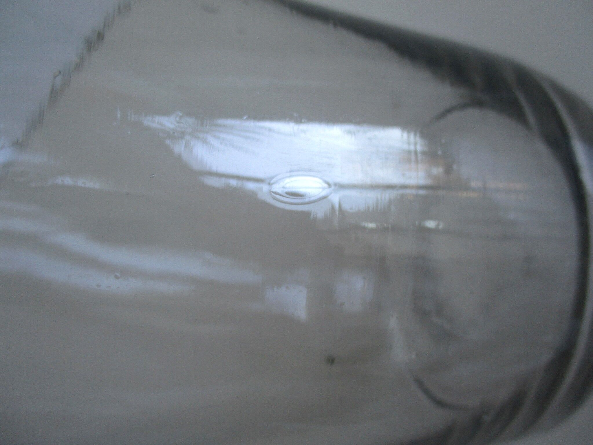 Large antique bottle made of blown glass