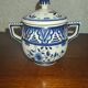 Henriot Quimper earthenware coffee set with floral decoration and elegant blue