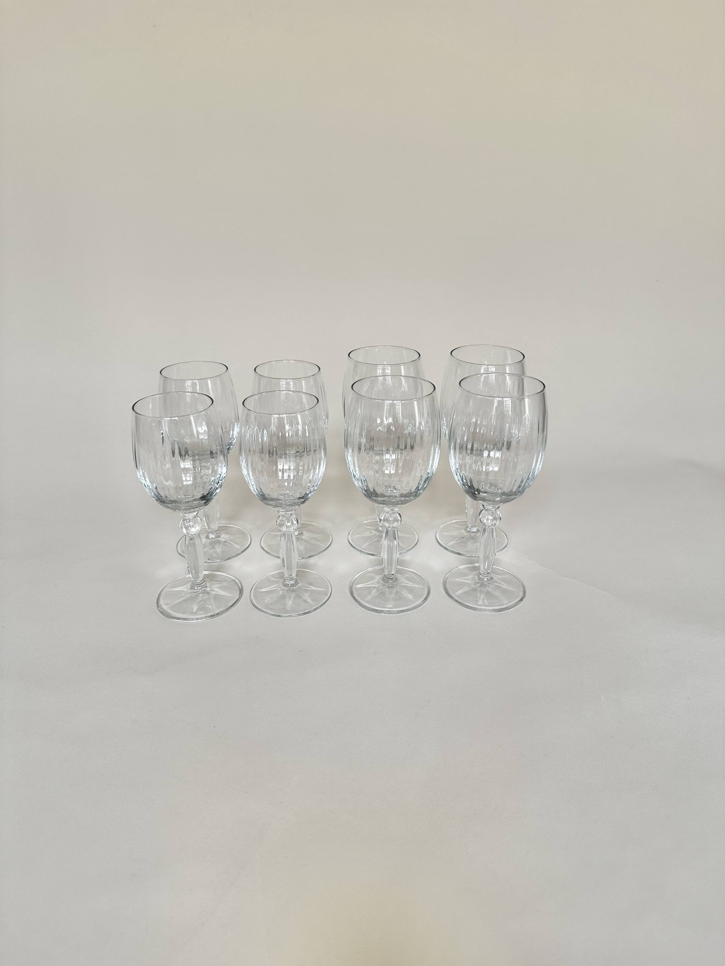 Set of 4 water glasses and 4 wine glasses, swirling glass