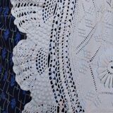 White bed throw with relief embroidery and floral patterns