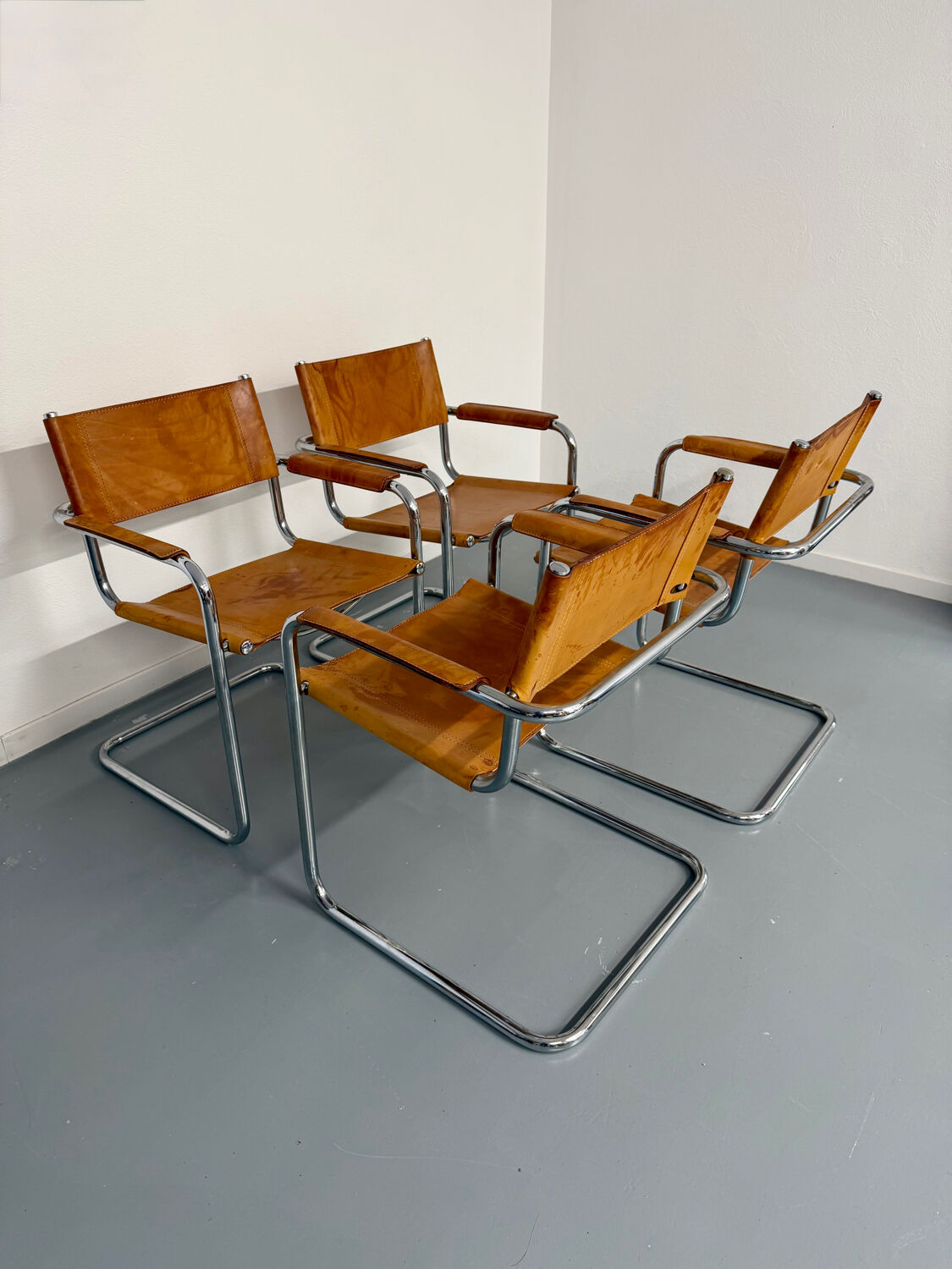 4 vintage tubular chairs with patinated leather designed by Mart Stam