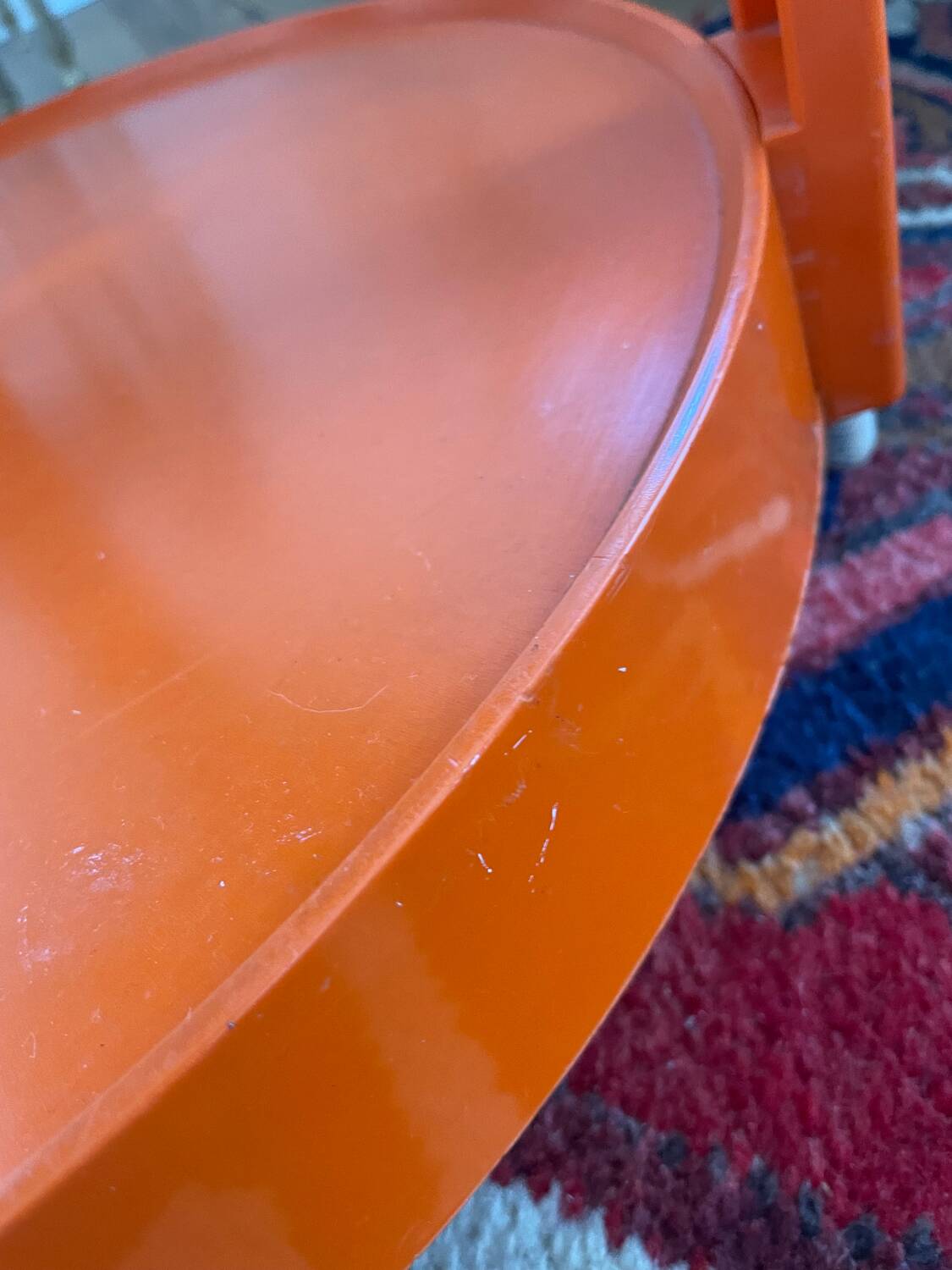 Round orange plastic side table 1970
