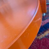 Round orange plastic side table 1970