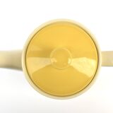 Old glazed ceramic coffee pot decorated with sunflowers