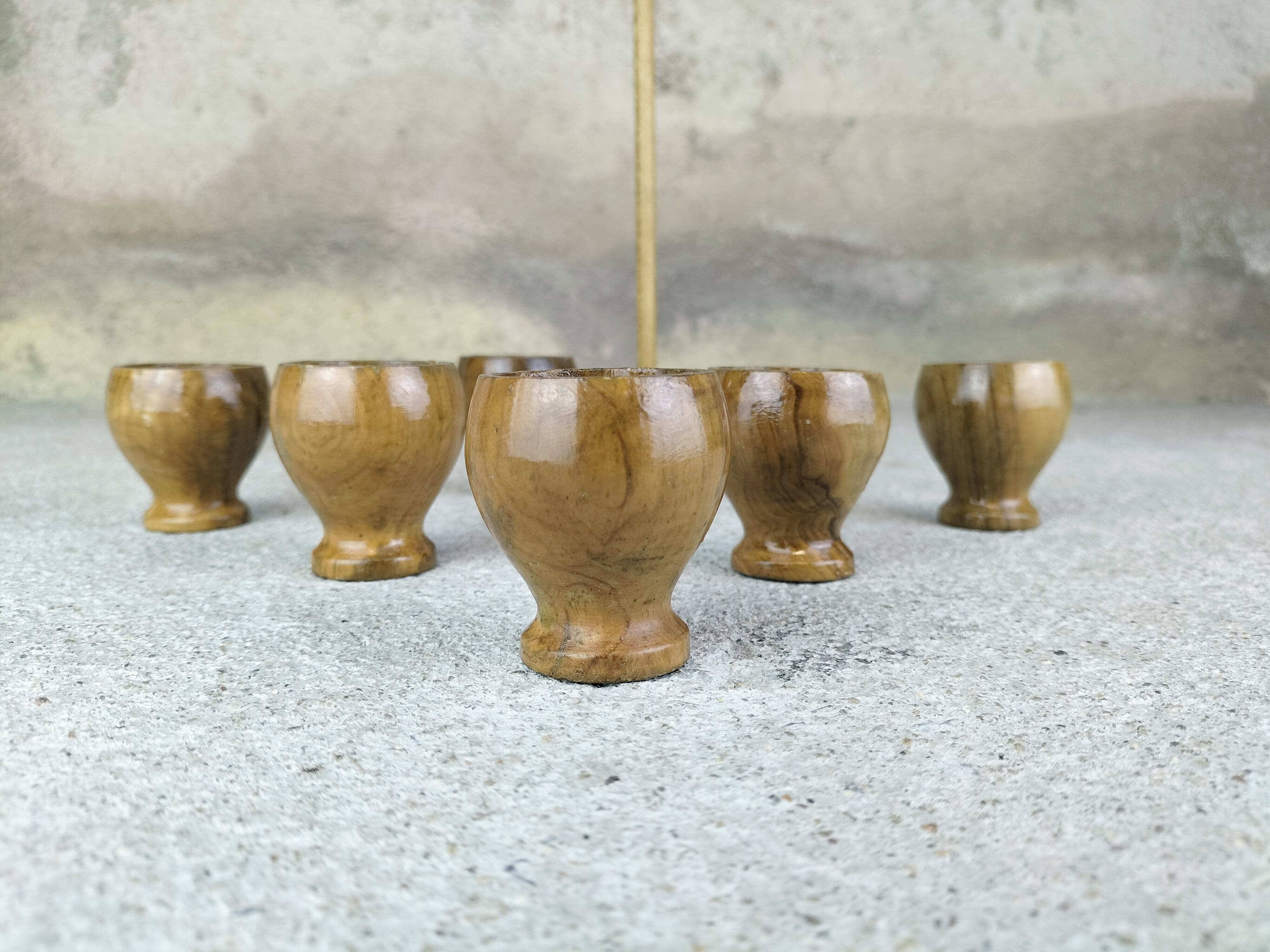 Set of six olive wood egg cups