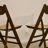 Pair of vintage folding chairs year 50 sculpted backrest.