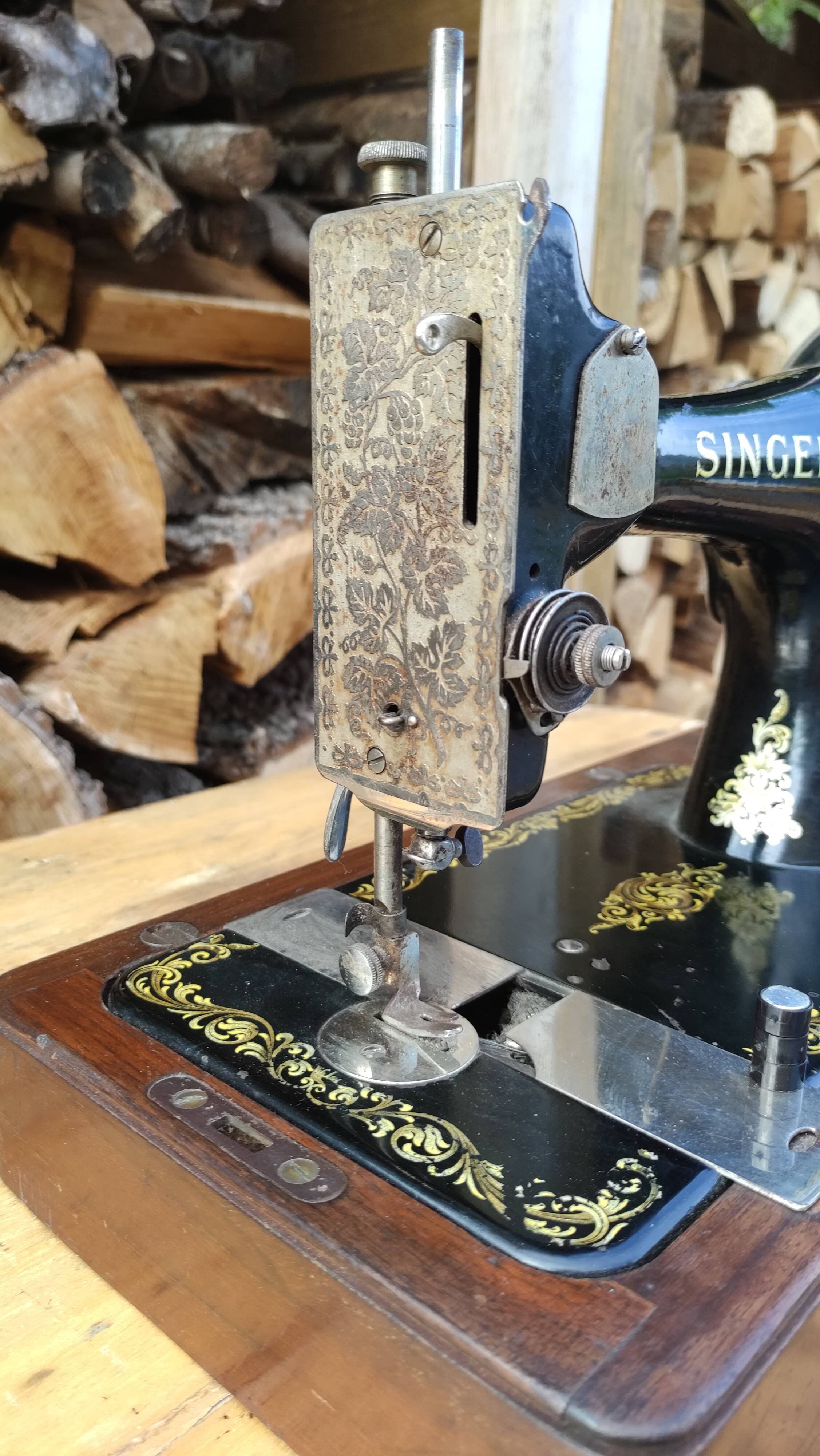 Old Singer sewing machine on its original base