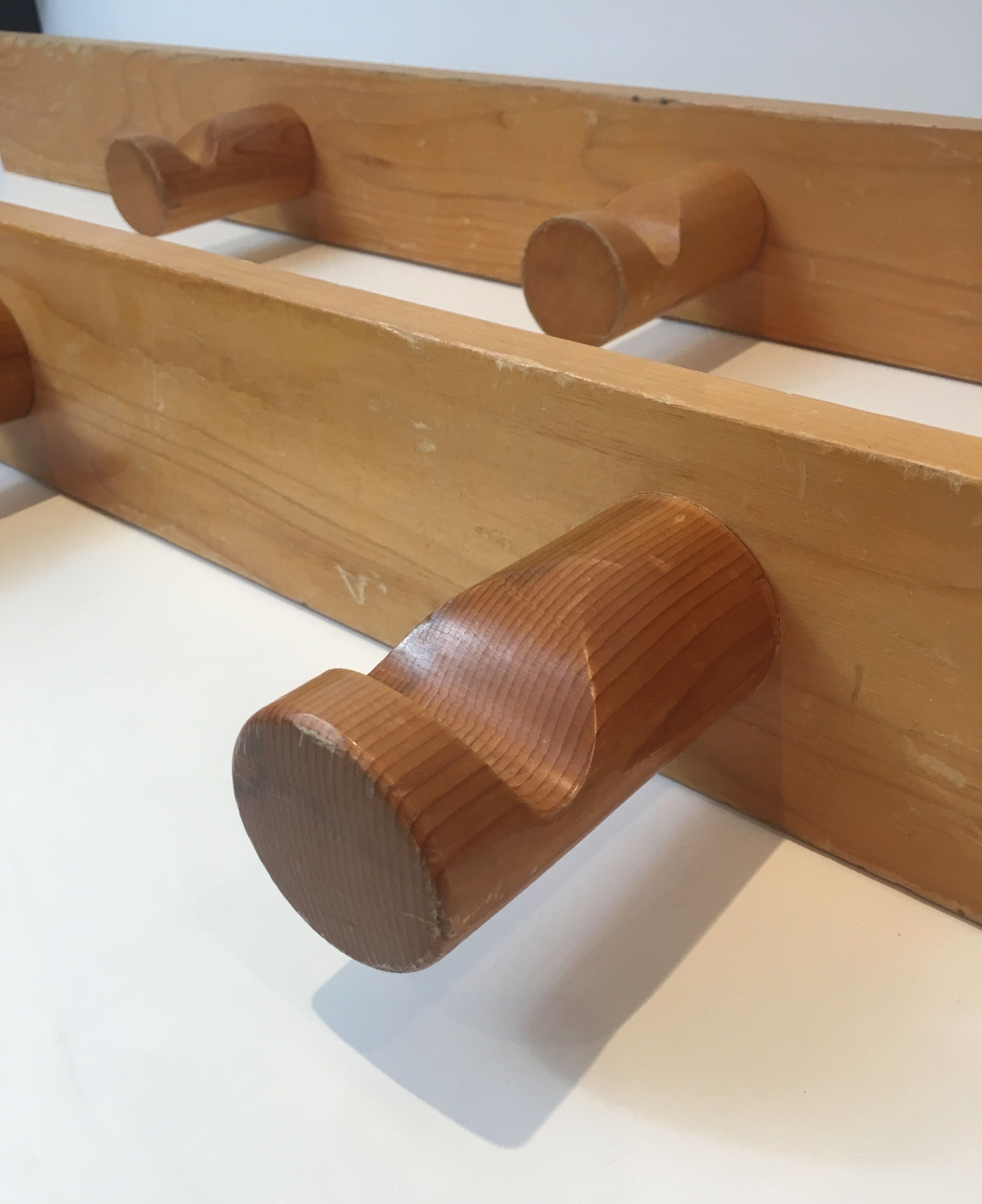 Charlotte Perriand, pair of fir wall coat racks, French work, around 1970