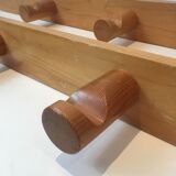 Charlotte Perriand, pair of fir wall coat racks, French work, around 1970