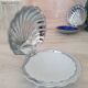 Shell butter dish in silver metal and its white glass cup
