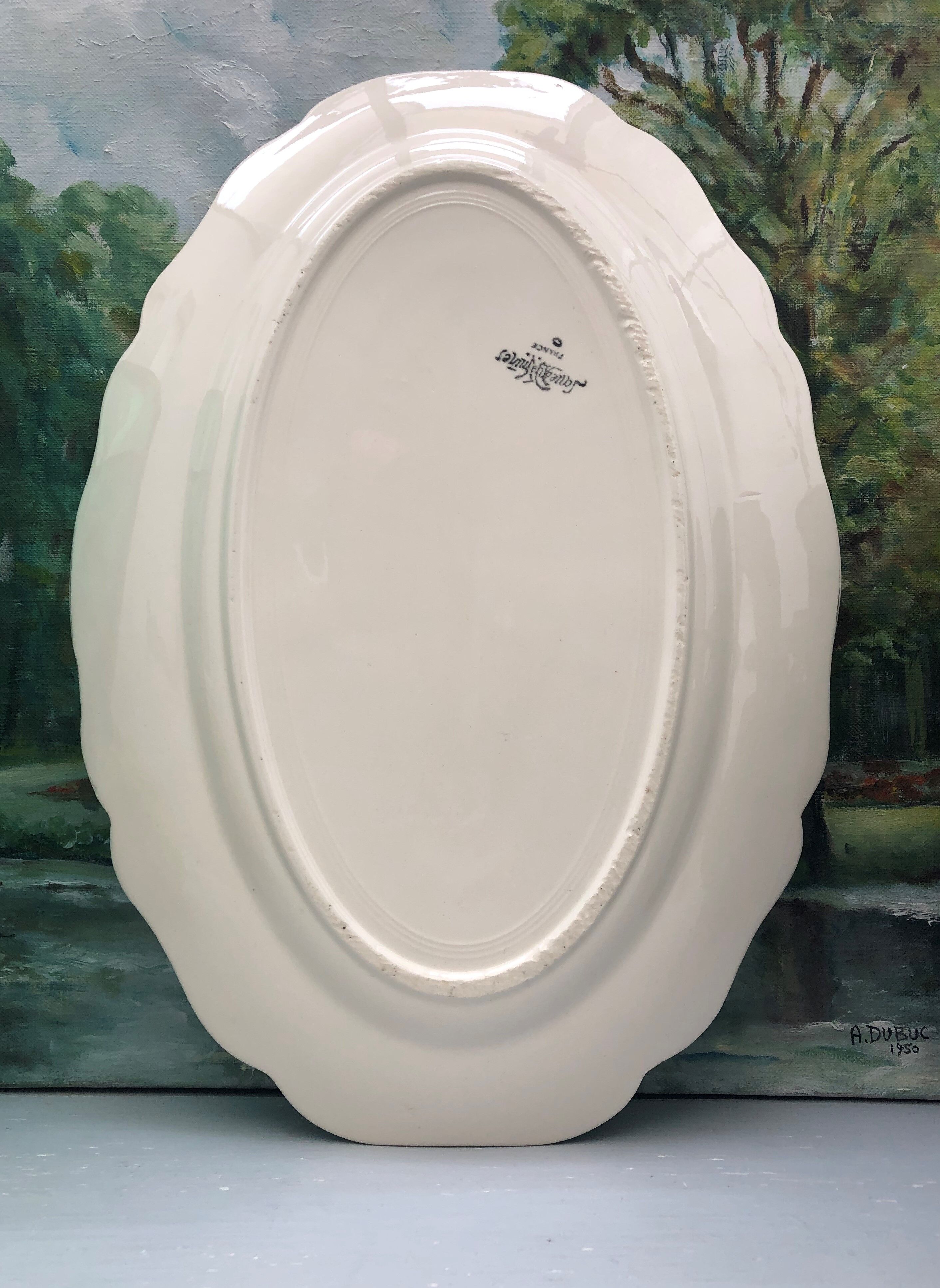 Oval ivory dish with gadroons, signed Sarreguemines France.