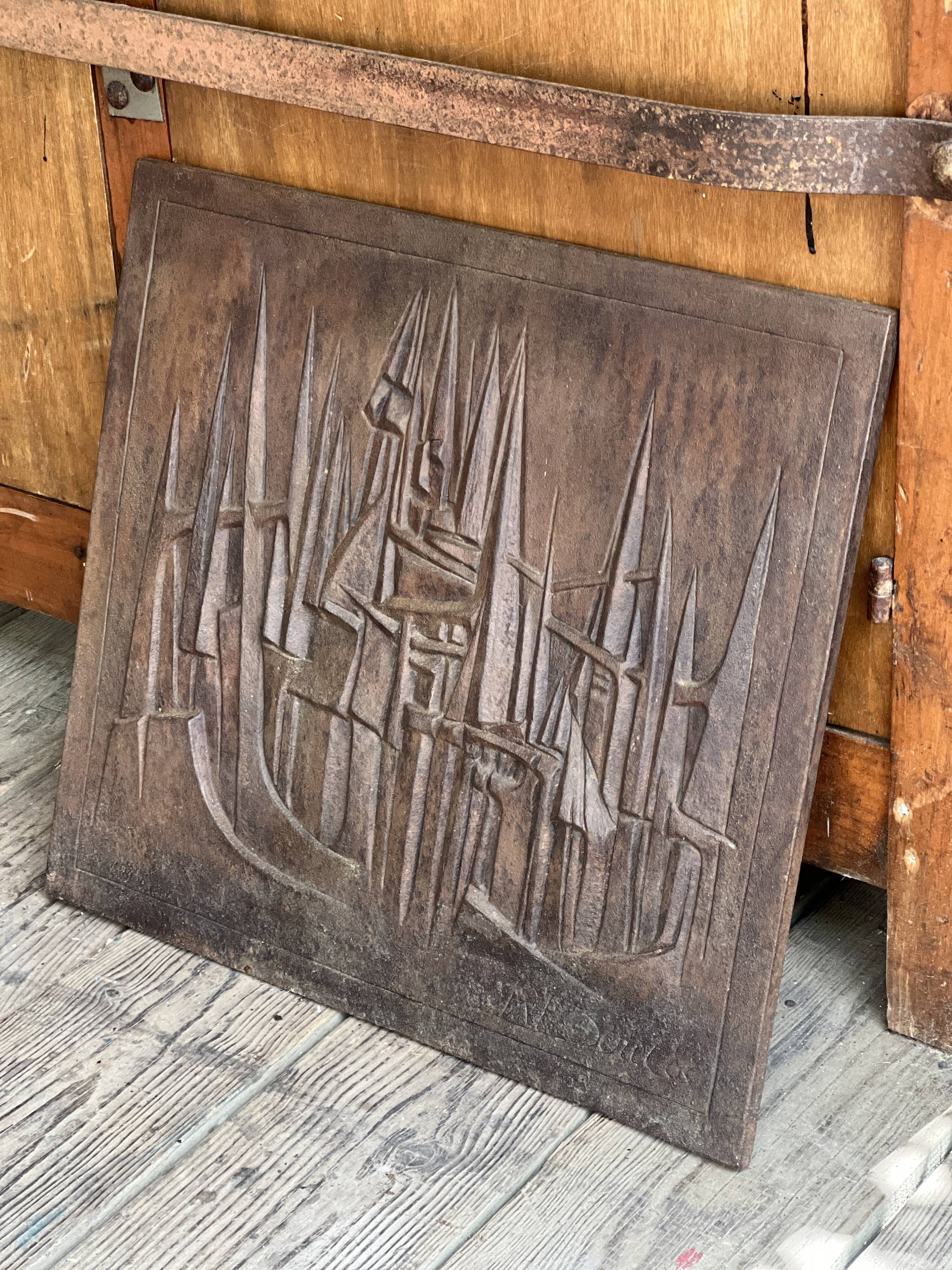 Cast iron plaque signed