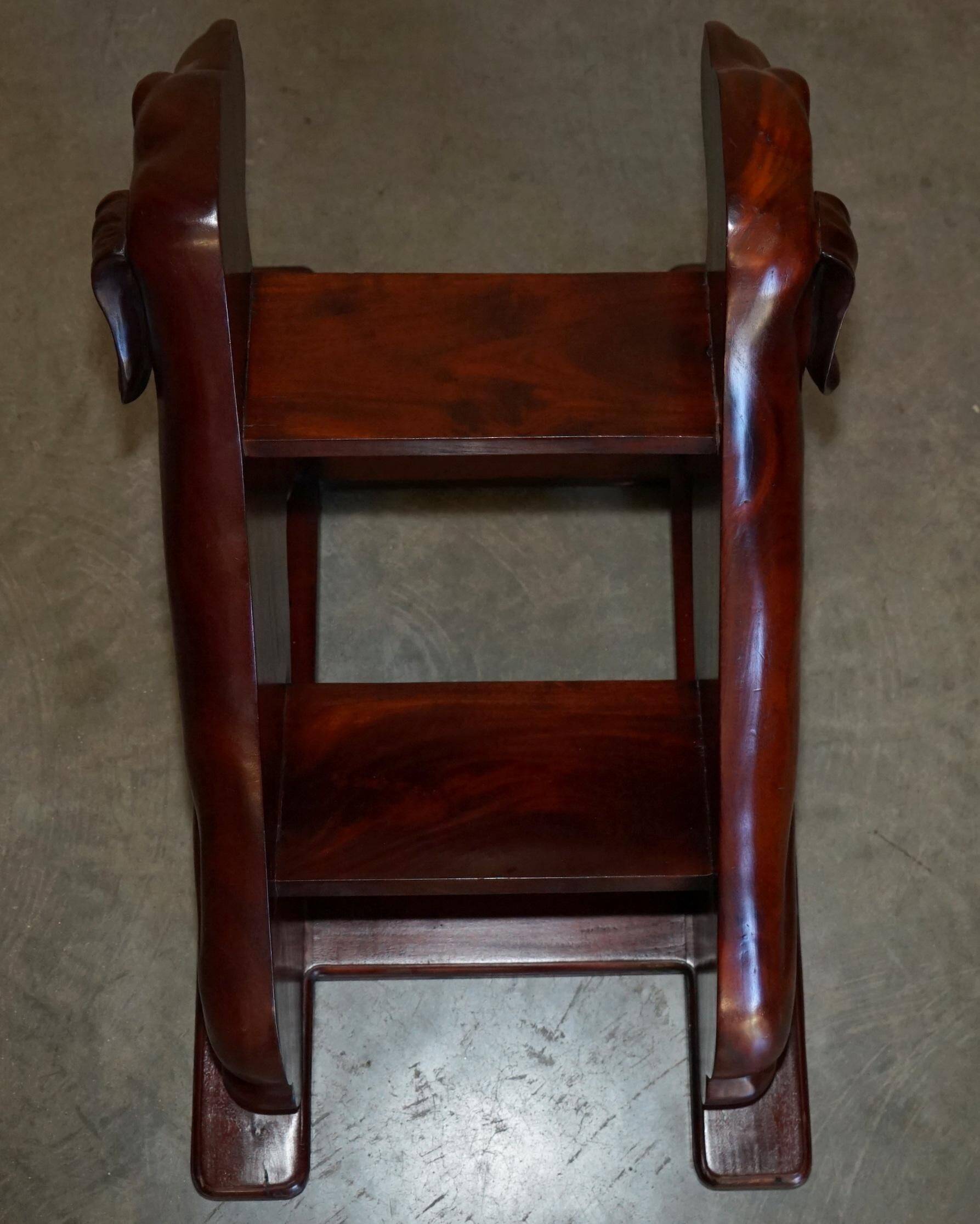Pair of hardwood library steps with carved dogs, Regency style.