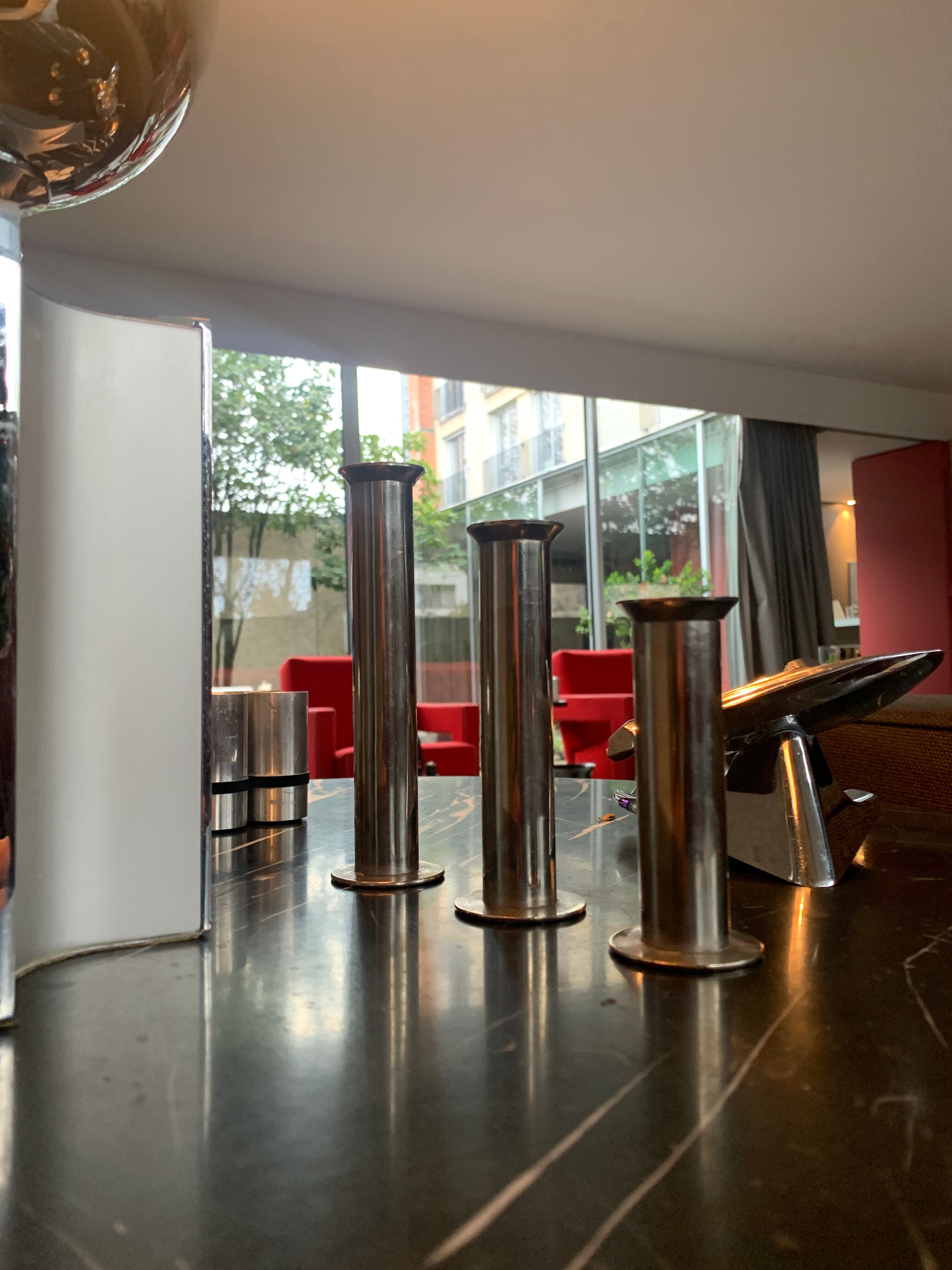 Three silver metal candle holders