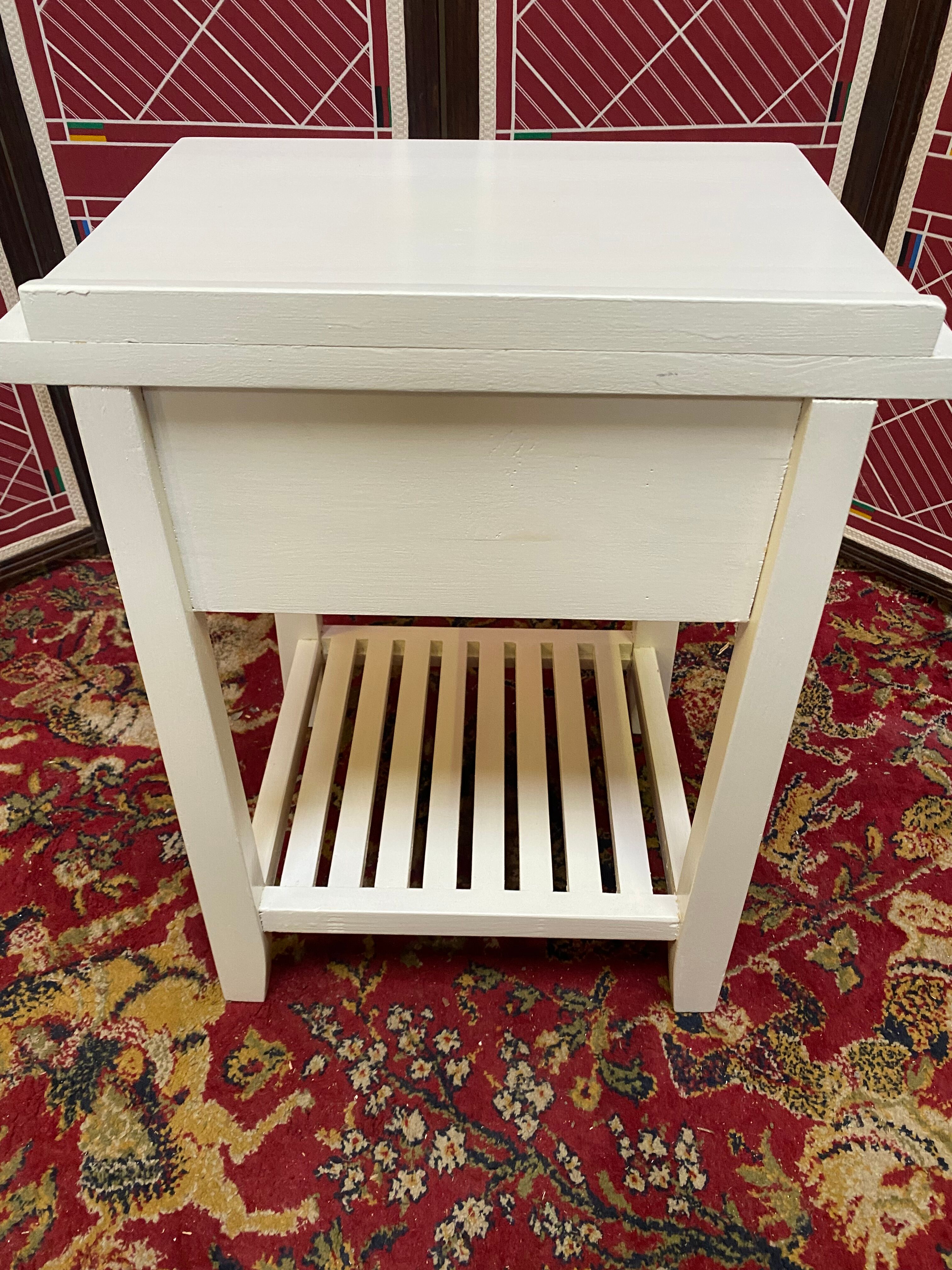 Wooden bedside table painted white