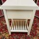Wooden bedside table painted white