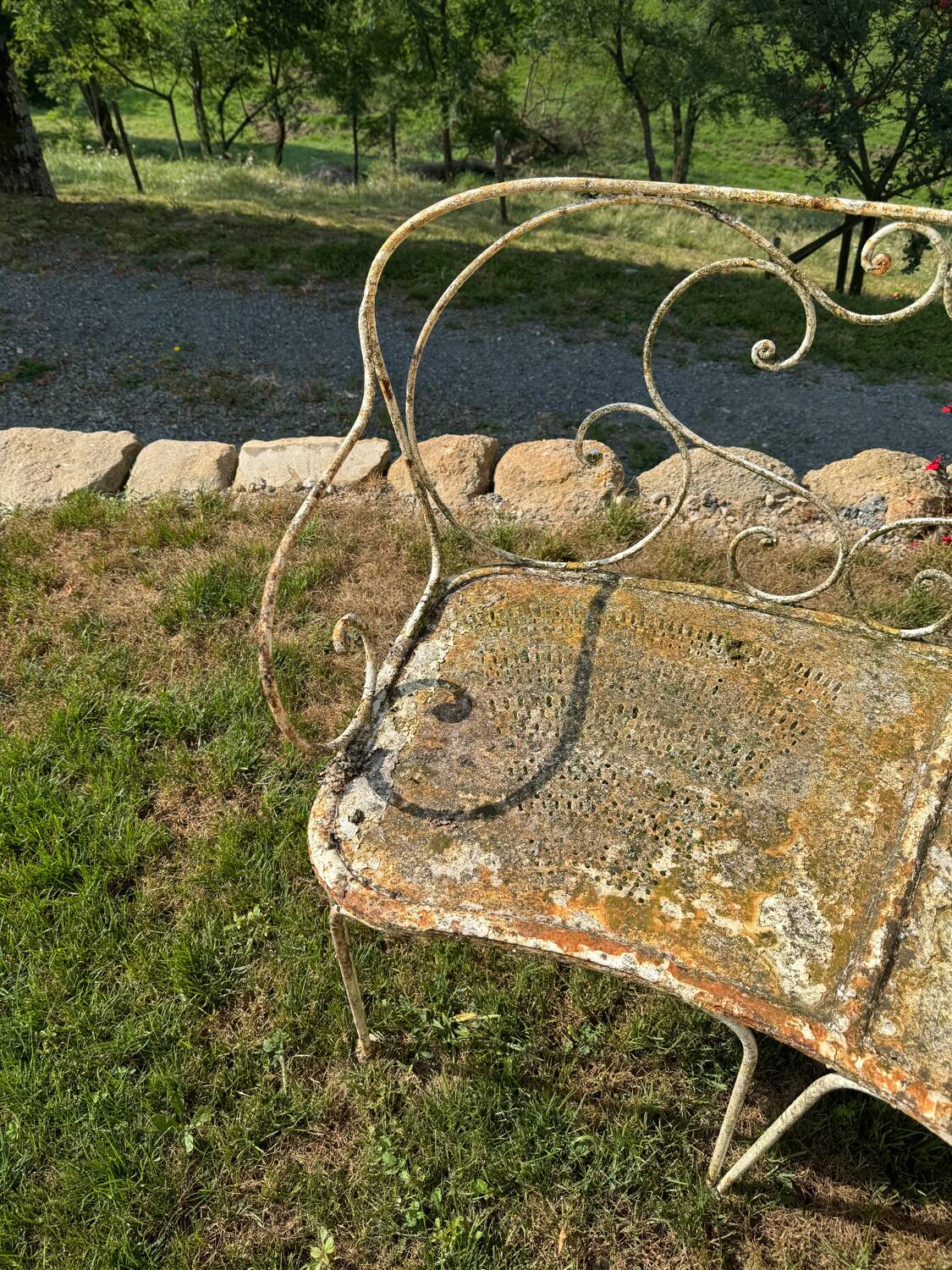 Wrought iron half-moon bench