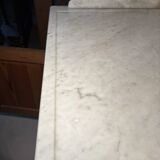 Antique wood and marble kitchen sideboard with carved backsplash