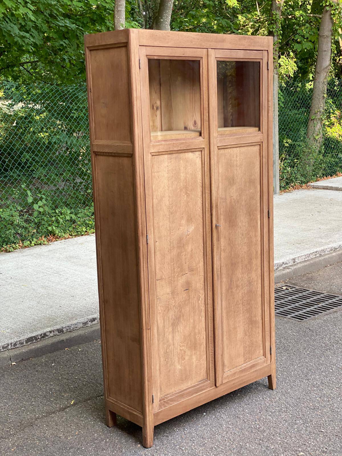Parisian bonnetière cabinet, stripped display in solid oak from the 1930s.