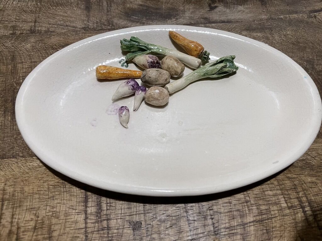 3 plates decorated with vegetables