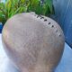 Vintage sandstone vase, in the shape of a rugby ball, signed