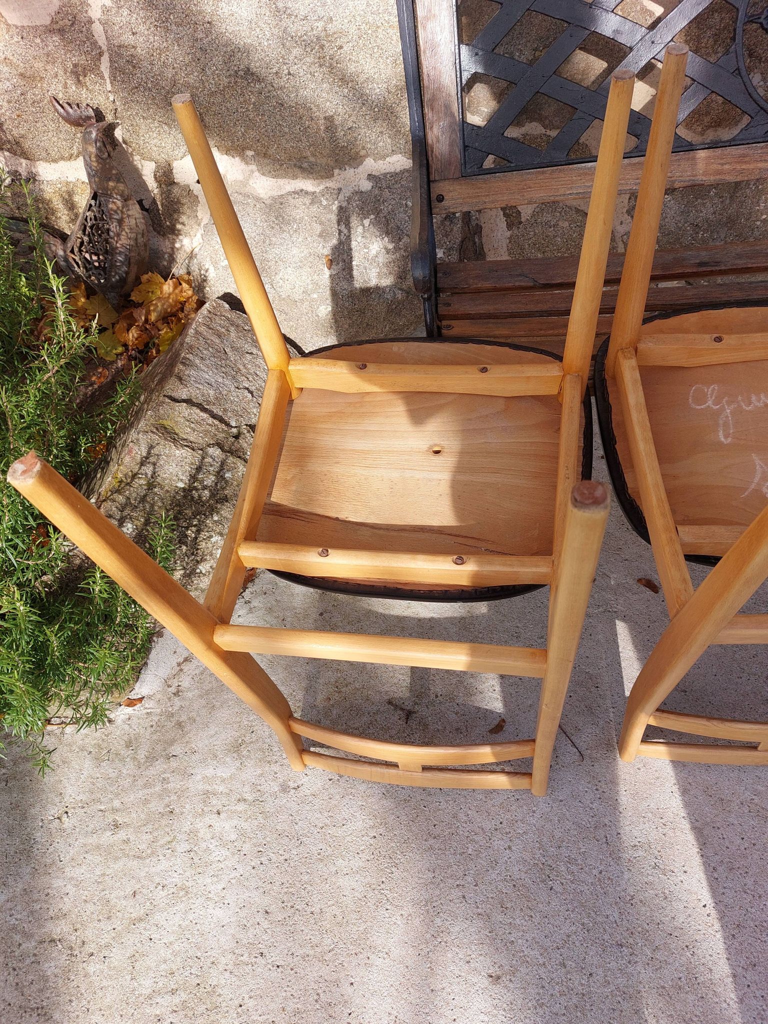 3 Scandinavian style chairs, light wood and black faux leather.