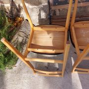 3 Scandinavian style chairs, light wood and black faux leather.