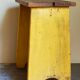 Art-populaire workshop stool in patinated painted wood