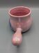 Iridescent pink frying pan, blue flower decoration