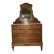 Antique carved wooden dressing table with marble and tilting oval mirror.