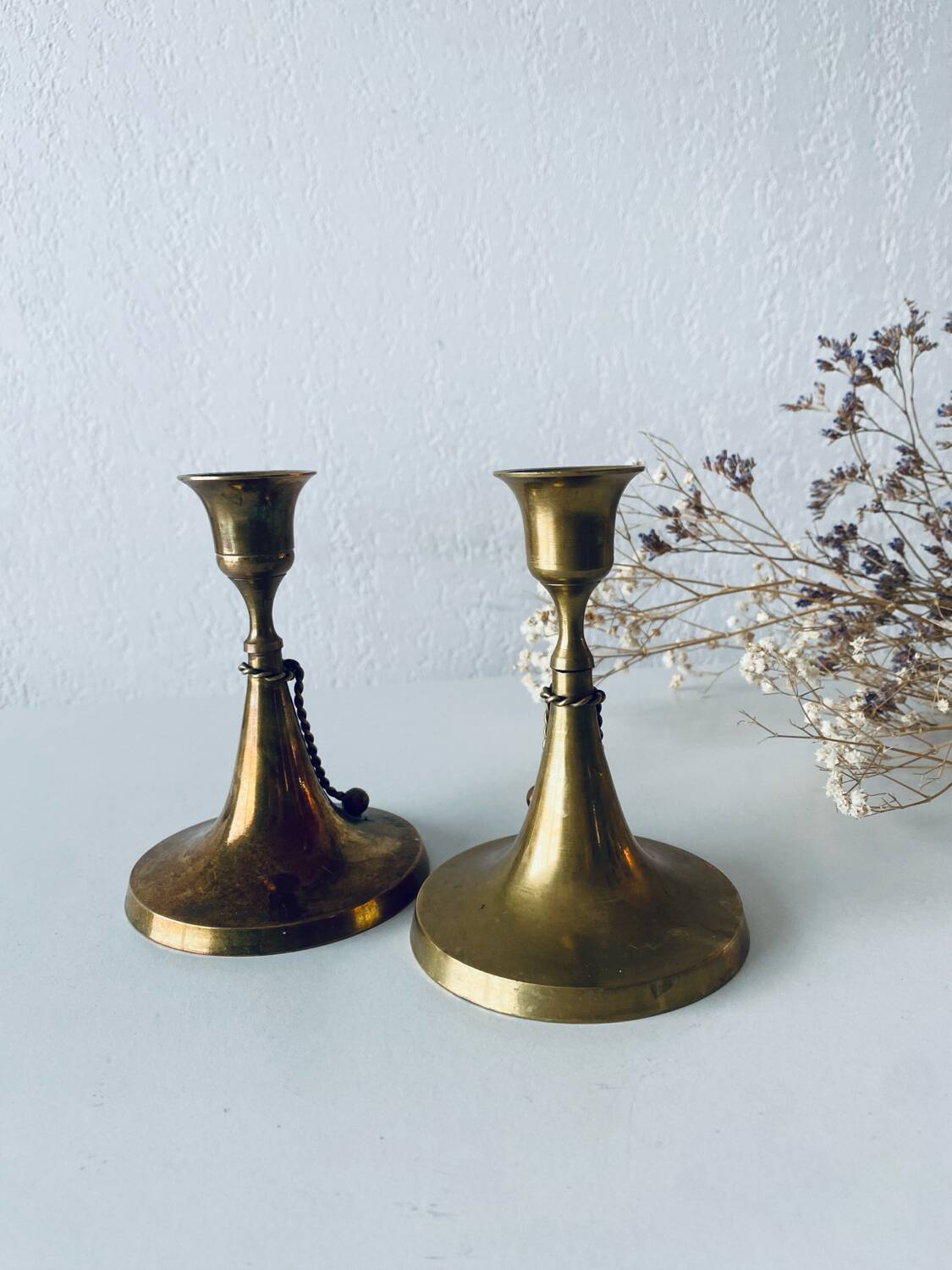 Pair of brass cord candle holders