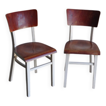 Set of dining chairs in painted white pine with brown wooden seats, 1950s.