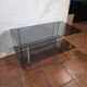 Smoked glass and brass coffee table from the 1970s.