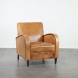 Luxury armchair made of cowhide leather with a beautiful warm colour scheme