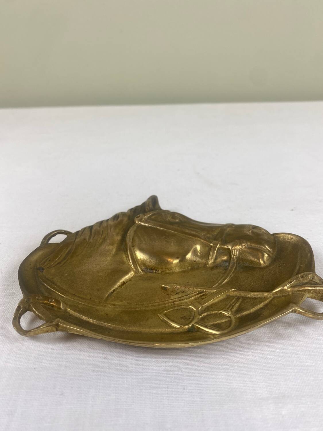 Antique brass pocket emptier