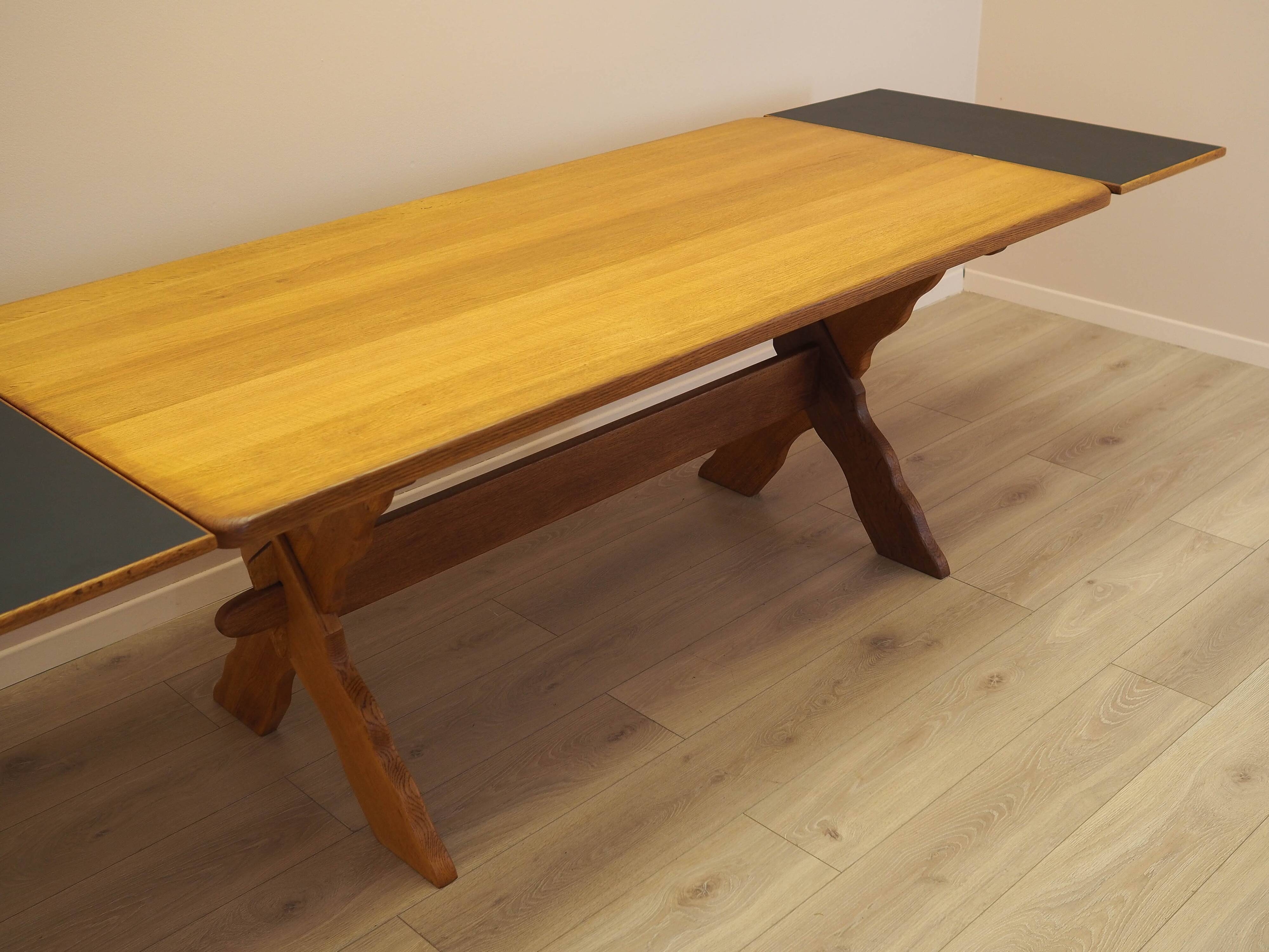 Solid oak dining table by Henning Kjærnulf, Denmark, 1960s