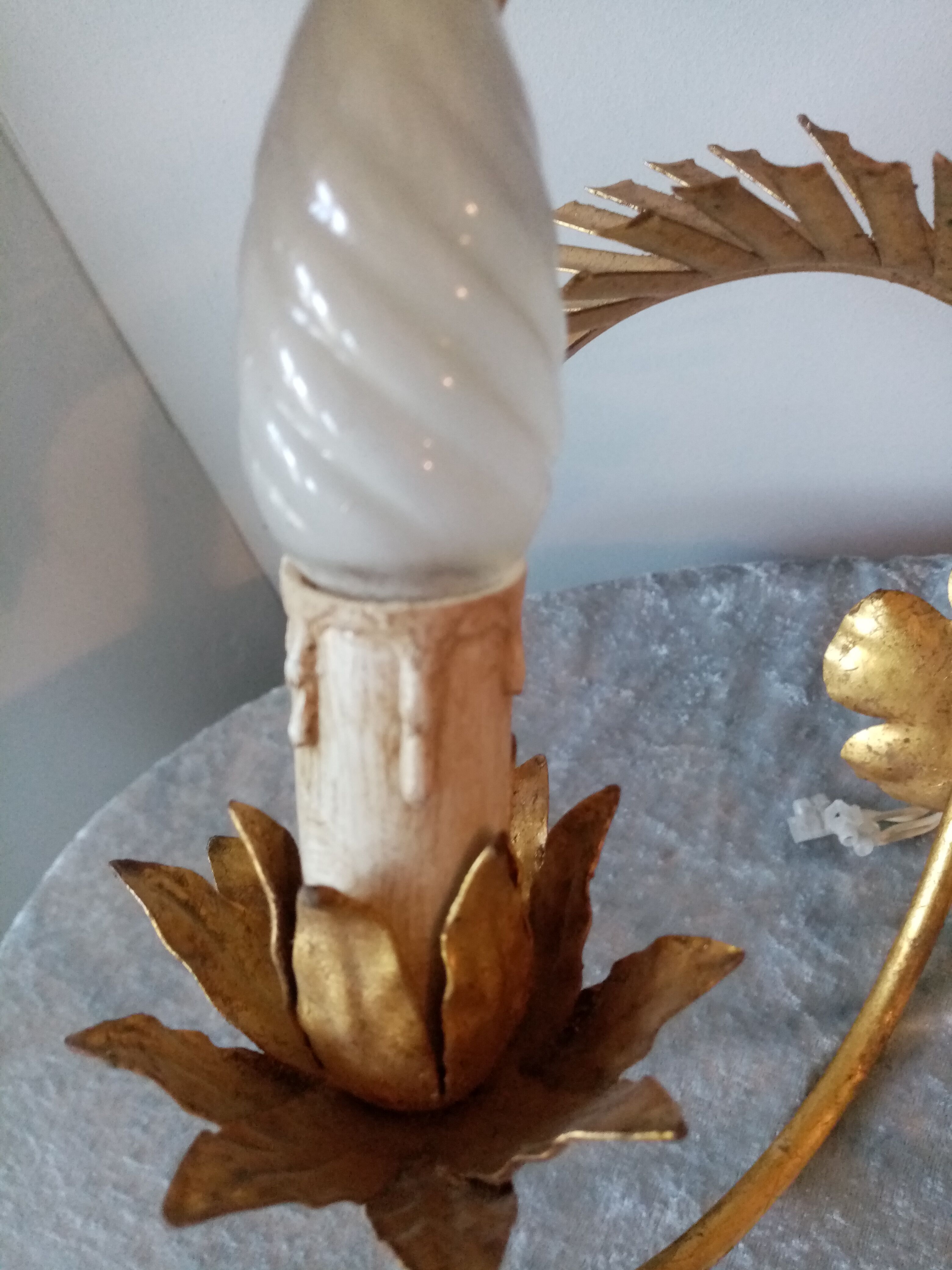 Old wall lamp palm shaped metal dore with leaf