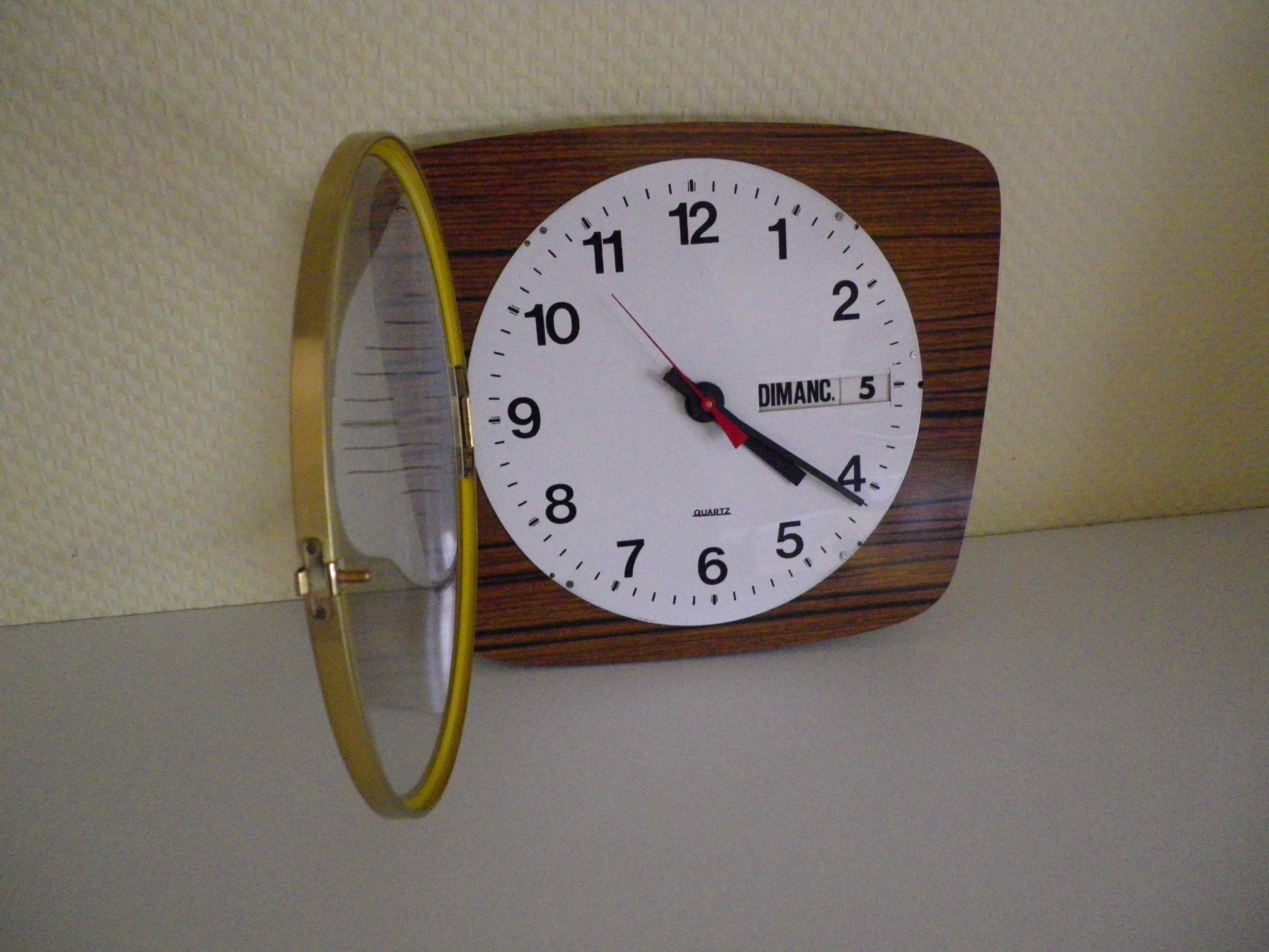 Formica wall clock with day and date - 1970s