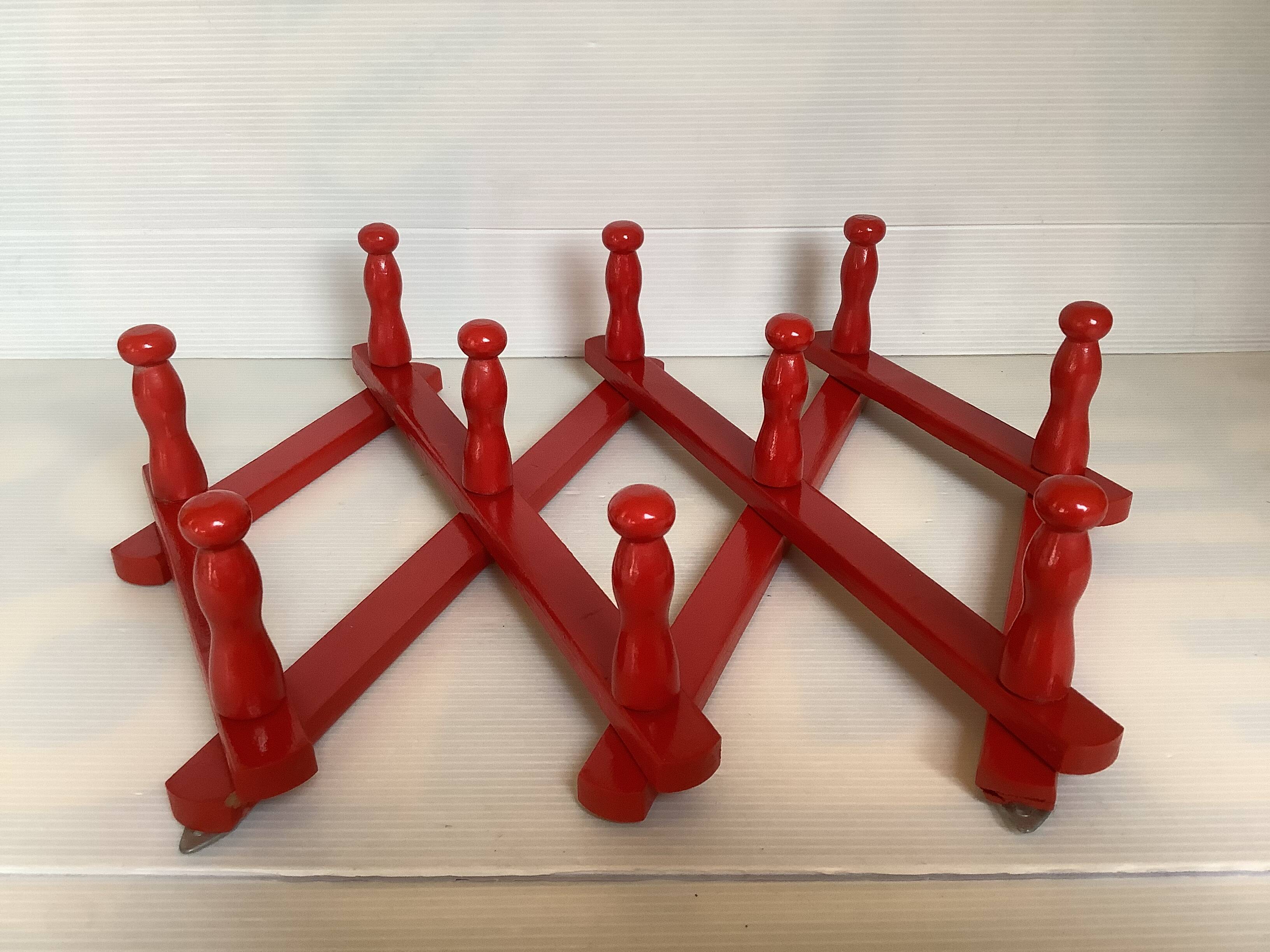 Red wood accordion coat rack