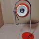 Eyeball space age orange desk or bedside lamp on an arc base