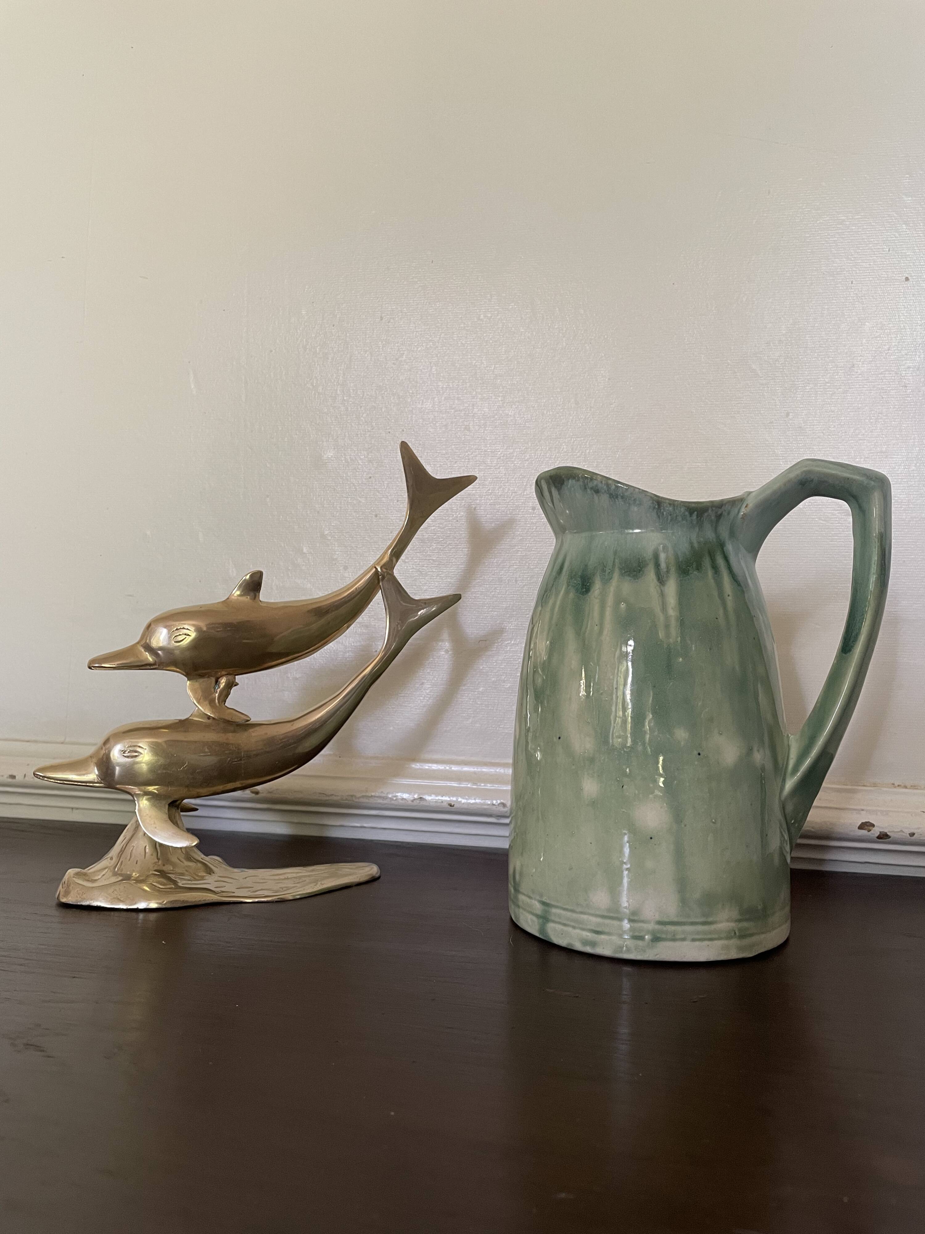 Turquoise green enamelled ceramic pitcher