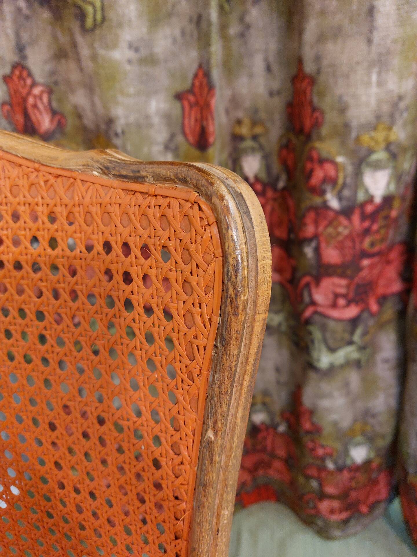 Caned chair in Louis XV style painted orange.