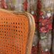 Caned chair in Louis XV style painted orange.