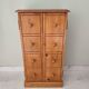 Small wooden piece of furniture, cabinet style, false drawers.