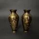 Pair of Japanese vases in chiselled bronze with inlaid bird decoration.