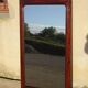 Large antique mirror in a flame mahogany frame; 132x82 cm