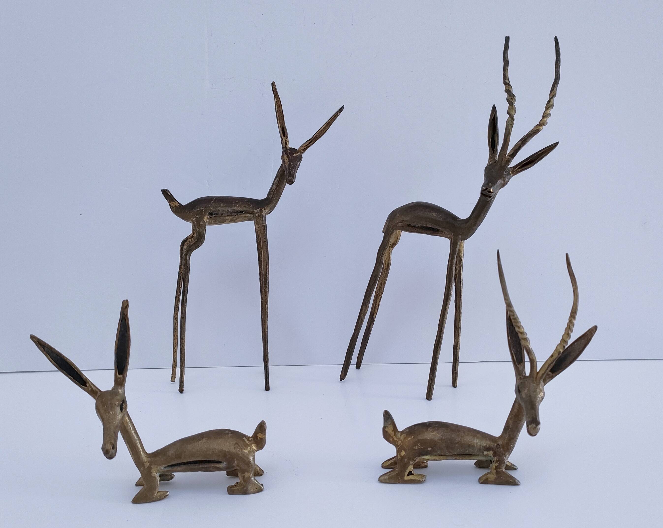 four vintage brass gazelle antelope sculptures